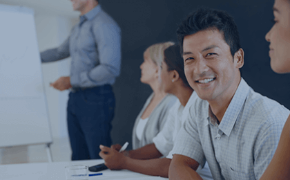 man smiling in sales meeting